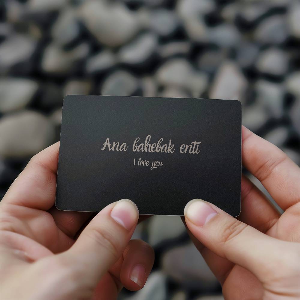 hallafa This I love you (arabic: Ana bahebak enta) wallet card for him is an amazing gift to show how much you care. Its sleek and lightweight design makes it easy to carry a constant reminder of your love with you at all times. Made from durable material, it fits perfectly in wallets or pockets. The elegant matte black finish pairs beautifully with the bright silver engraving, beautifully displaying your heartfelt message. Whether it's for a special occasion or just to bring a smile to their face, this car