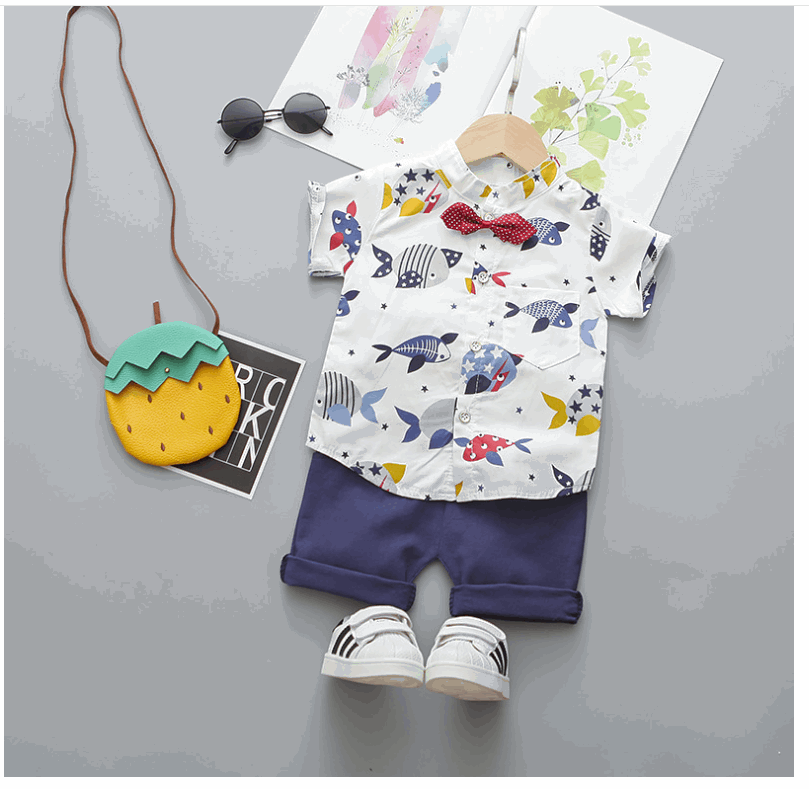 Boy´s cartoon printed outfit 3-piece set - Hallafa He'll feel dapper in this fashionable set featuring a cartoon print top, shorts and bow. Perfect for day-to-day wear, special occasions, and photoshoots, this stylish ensemble is made with high-quality materials for a super soft and safe feel. A great baby shower gift, too! · Material: Cotton Blend Please allow slight 1-3cm difference due to manual measurement and a little color variation for different display setting. #