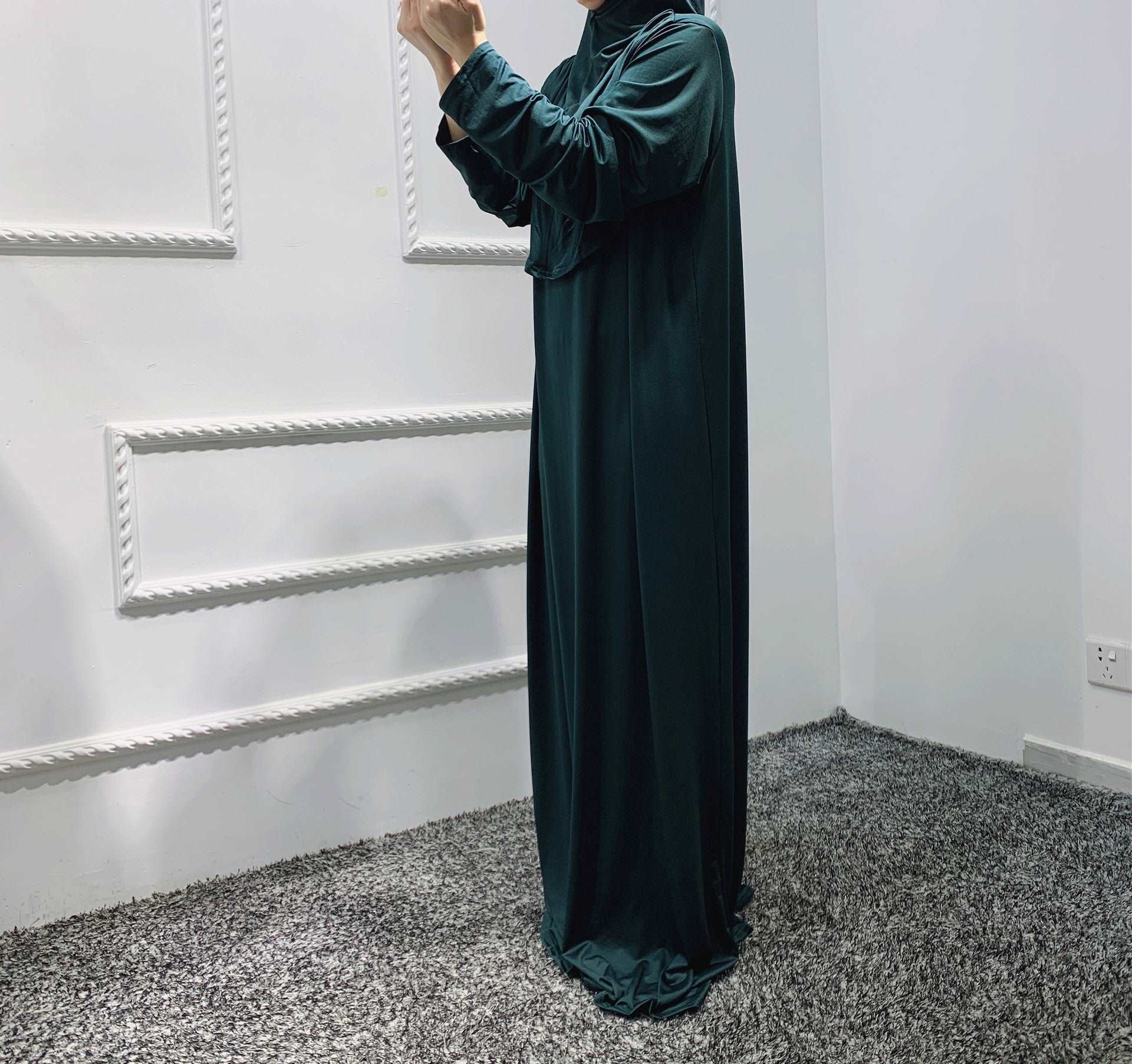 Prayer dress with hijab - Hallafa Slip into stylish serenity with this solid-colored prayer dress, crafted from a comfy stretch fabric that easily fits sizes 36-52. Perfect for Muslim women! Fabric Name : Polyester Fiber Size Information: (CM) Length One size 141 #