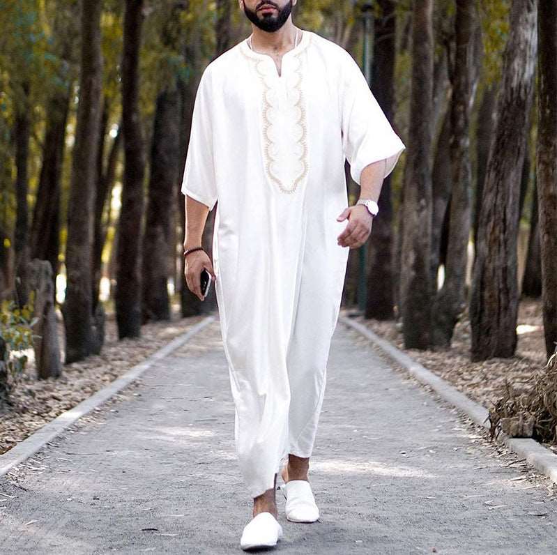 "men mid sleeves white jubba with golden accents."