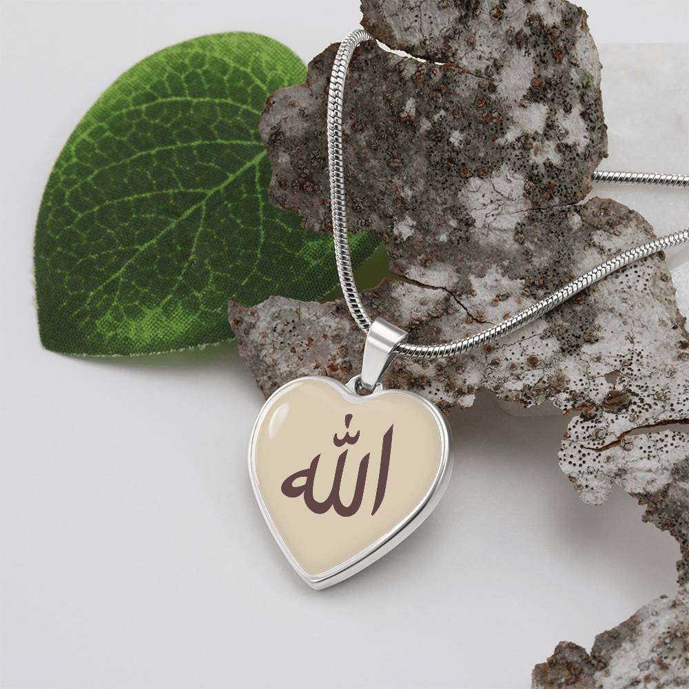 Allah Heart Necklace - Hallafa This stunning piece of jewelry, crafted from high-quality surgical steel and available with an 18k gold finish, is a perfect and meaningful gift for yourself or a loved one. It symbolizes love, connection, and gratitude, staying close to the wearer's heart at all times. This jewelry represents more than just beauty – it tells a story and carries deep sentimental value. Product Dimensions · Luxury Necklace: 18-22" (45-56cm) adjustable· Heart Pendant: 24mm x 24mm #