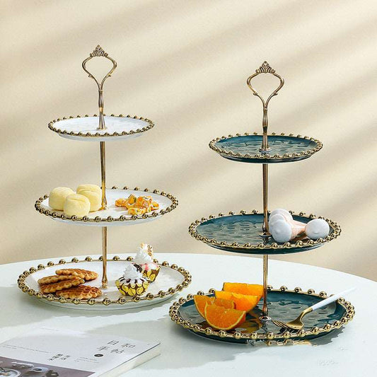 Ceramic dessert tray rack - Hallafa Delight your dessert display with our Ceramic Tray Rack! Offered in two shades - bright white and verdant green - each plate boasts a chic golden rim. Select from 3 choices (two or three tiers of storage) for your snacking requirements. Crafted from hard-wearing ceramic. Ideal for Ramadan and Eid celebrations, too! Note: The following products are all measured by hand and there will inevitably be errors, please refer to the actual product! #