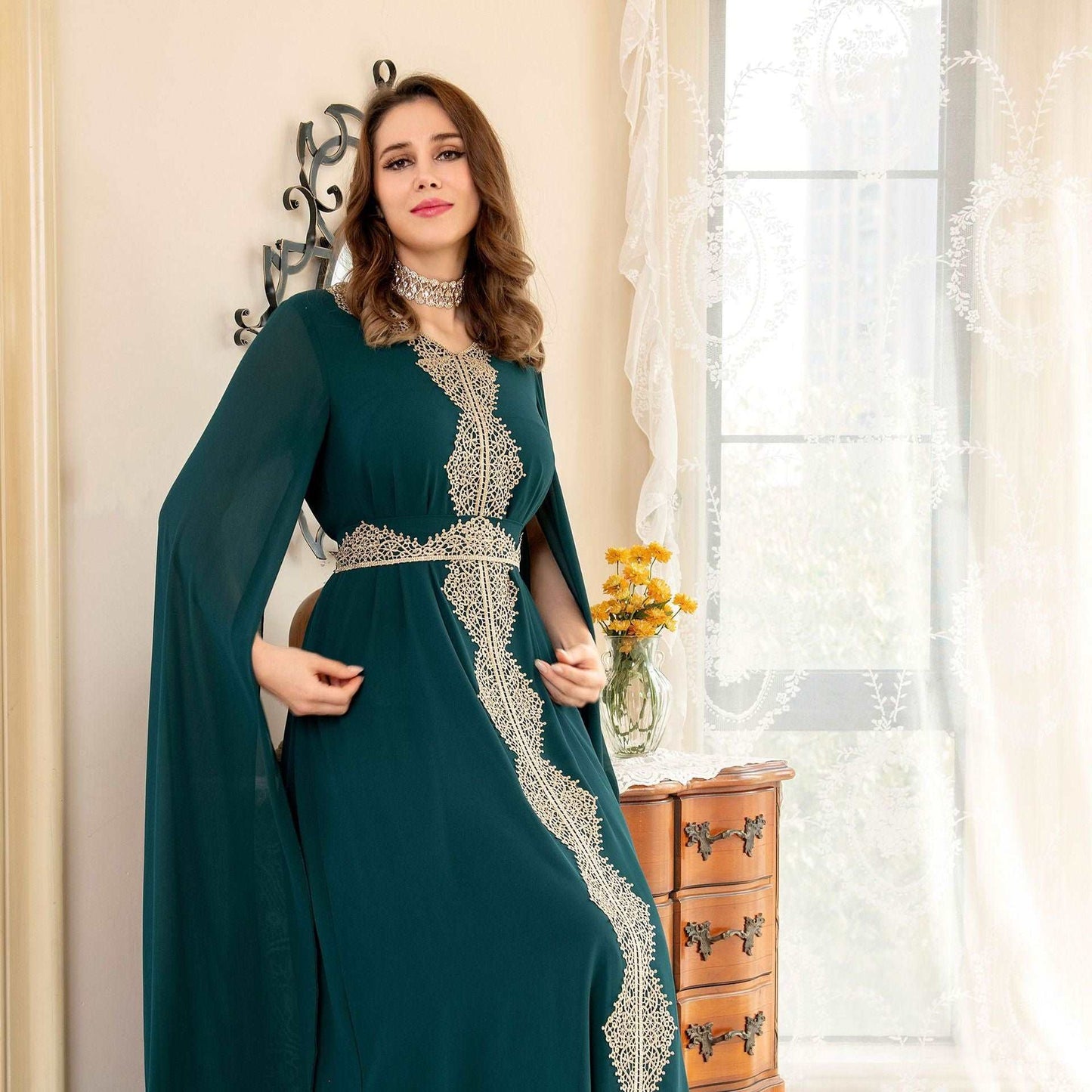 "Green chiffon farasha dress/ abaya with golden lace details."