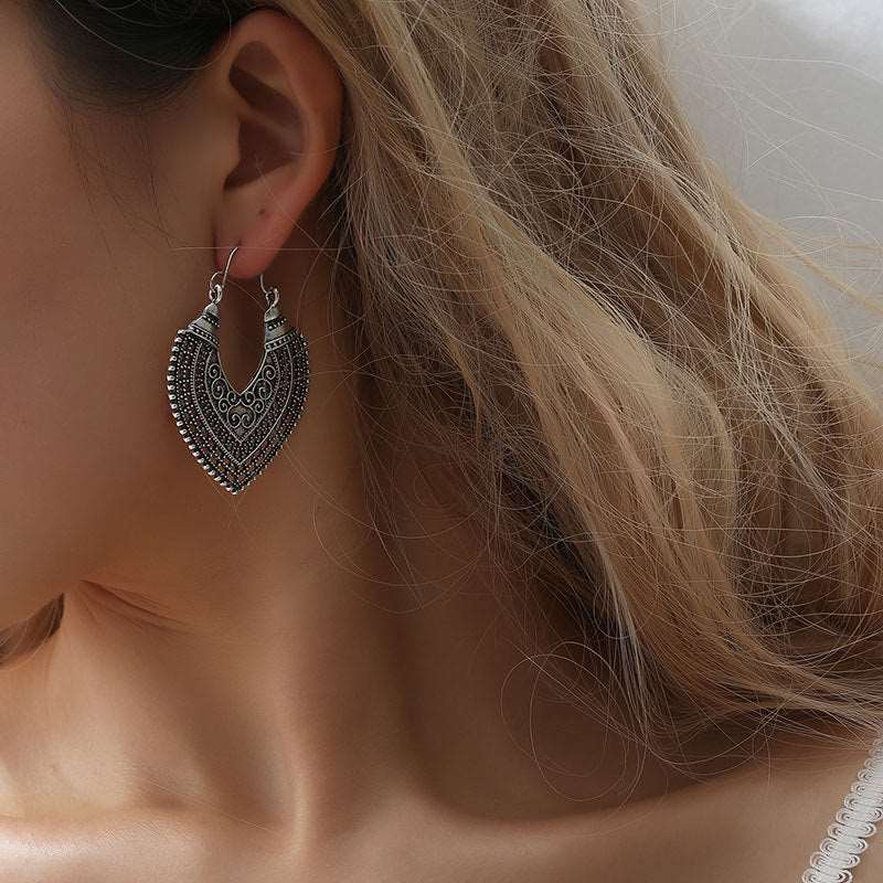 Hanging Earrings - Hallafa Adorn your ears with these stunning Hanging Earrings! Crafted of Alloy, these shimmering beauties come in two alluring shades of bronze and silver. #