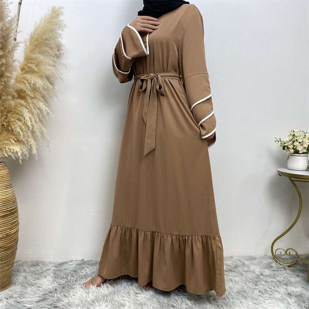 "Brown Abaya dress, pleats and white details."