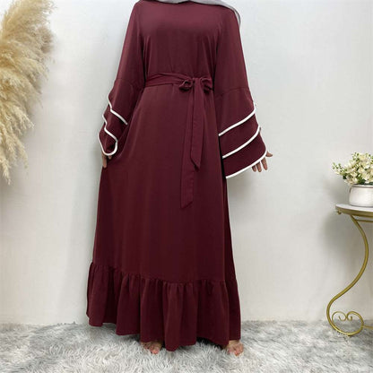 "Dullred Abaya dress, pleats and white details."