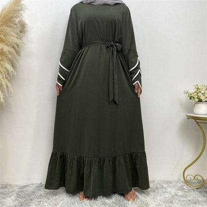 "Green Abaya dress, pleats and white details."