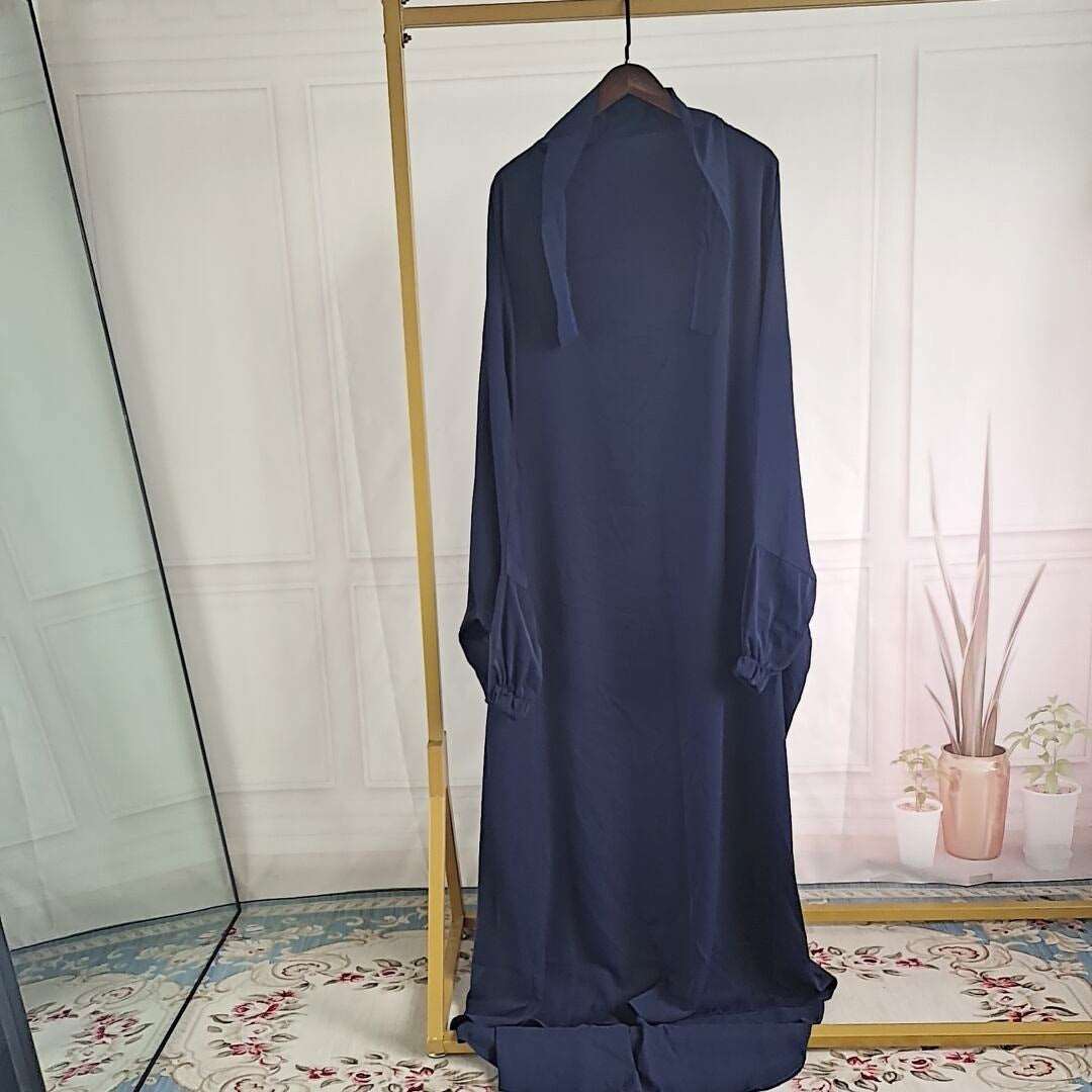 "Dark blue Jilbab one piece."
