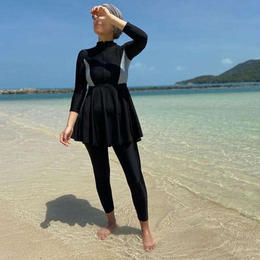 "modest swimwear. black pants with black dress, zip on front."