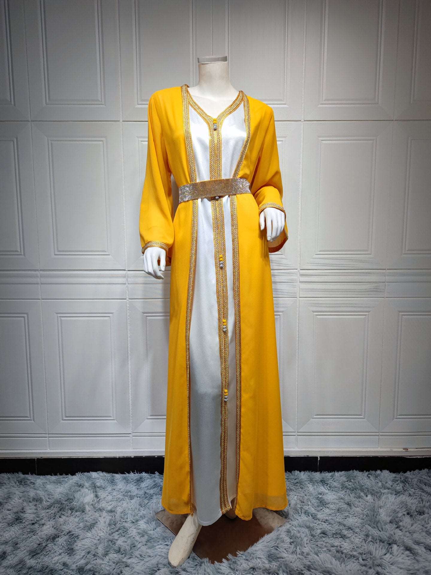 "yellow Embroidered Takchita with belt."