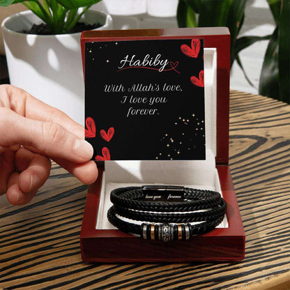 Hallafa Men's "Love You Forever" Bracelet. Searching for a gift as extraordinary as the man in your life? Our Men's "Love You Forever" Bracelet is just the right choice! Engraved with a heartfelt message, this bracelet is ideal for birthdays, anniversaries, or simply to say "I love you." More than just an accessory, it's a daily reminder of your love and appreciation.
 

Crafted from durable stainless steel and vegan leather, this bracelet is not only stylish but also built to last. The strong magnetic clas