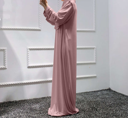 Prayer dress with hijab - Hallafa Slip into stylish serenity with this solid-colored prayer dress, crafted from a comfy stretch fabric that easily fits sizes 36-52. Perfect for Muslim women! Fabric Name : Polyester Fiber Size Information: (CM) Length One size 141 #