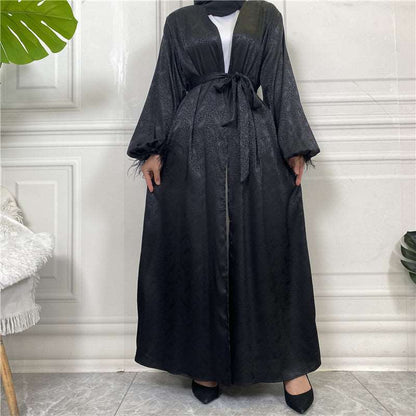 "Black satin open Abaya/Kimono featuring puff sleeves."