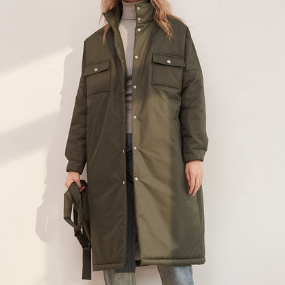 "army green women parka coat with belt, pockets on front."