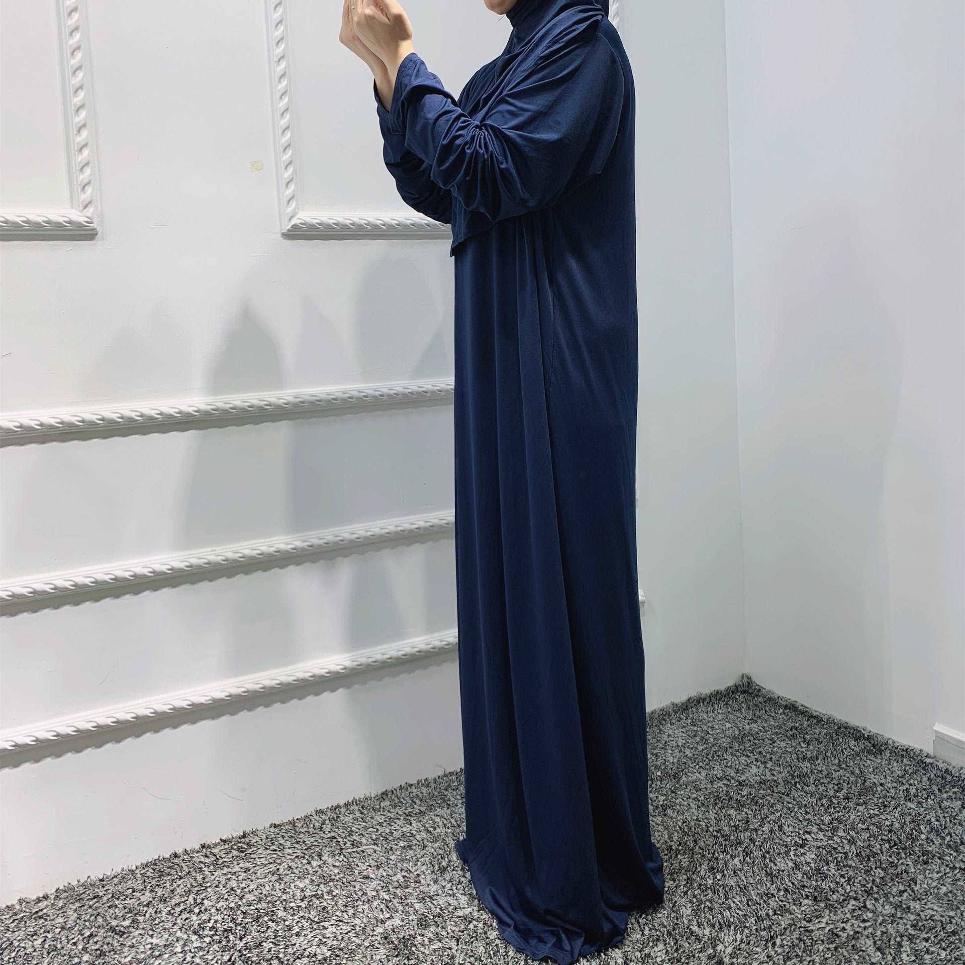 Prayer dress with hijab - Hallafa Slip into stylish serenity with this solid-colored prayer dress, crafted from a comfy stretch fabric that easily fits sizes 36-52. Perfect for Muslim women! Fabric Name : Polyester Fiber Size Information: (CM) Length One size 141 #